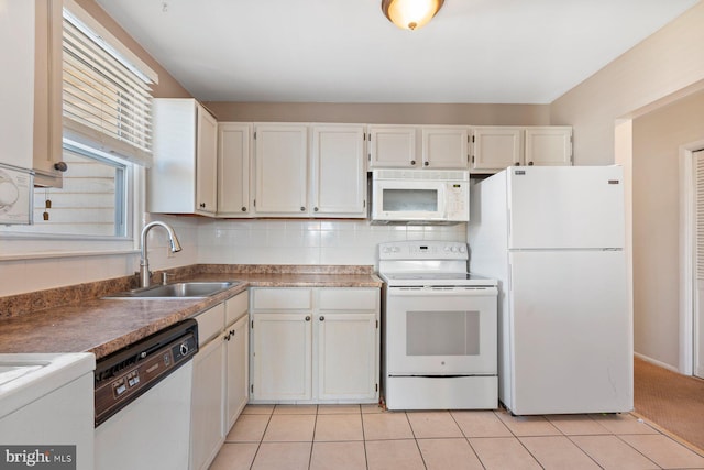 kitchen with backsplash, sink, white appliances, white cabinetry, and light tile patterned flooring