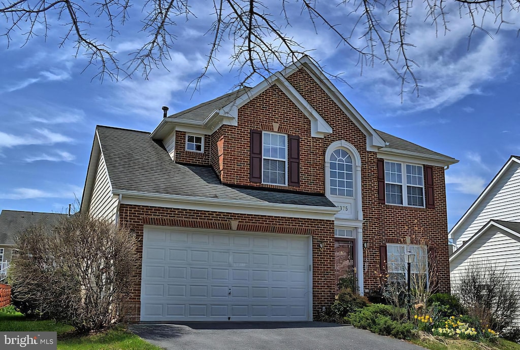 front of property featuring a garage