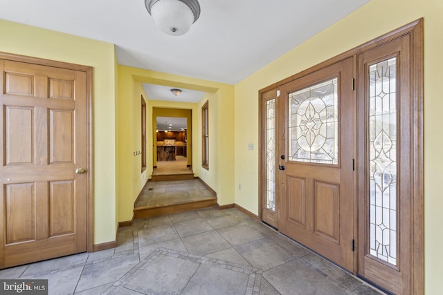 entrance foyer with light tile patterned floors