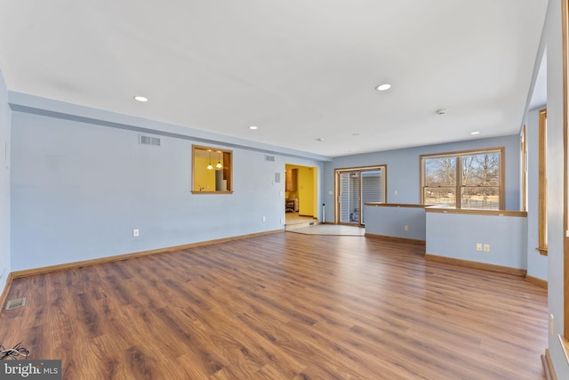 unfurnished living room with hardwood / wood-style flooring