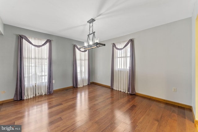 unfurnished room featuring dark hardwood / wood-style flooring