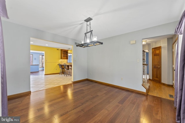 unfurnished dining area with light wood-type flooring