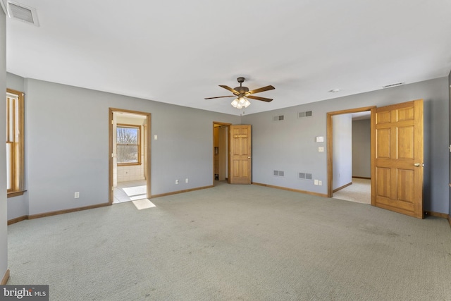 carpeted empty room with ceiling fan