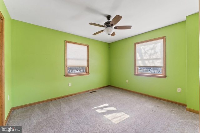 carpeted empty room with ceiling fan