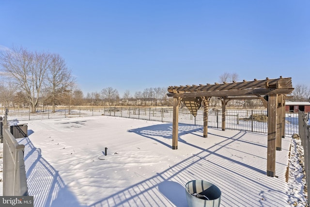 snowy yard with a pergola