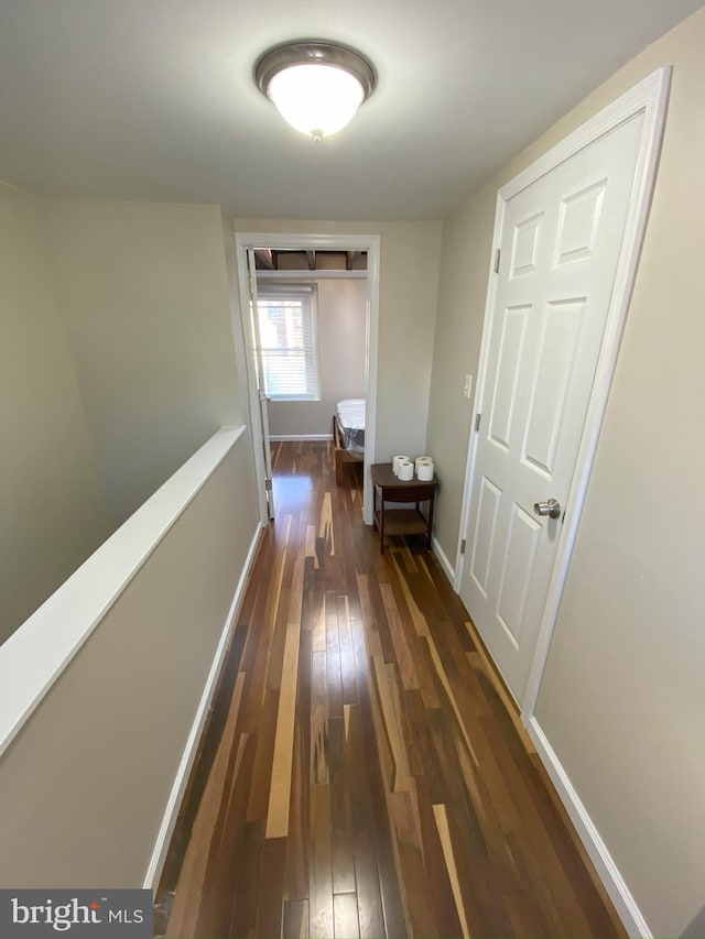 hallway featuring dark wood-type flooring