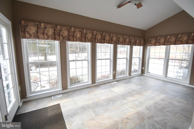 unfurnished sunroom featuring vaulted ceiling and ceiling fan