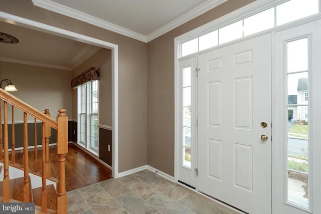 foyer entrance featuring ornamental molding