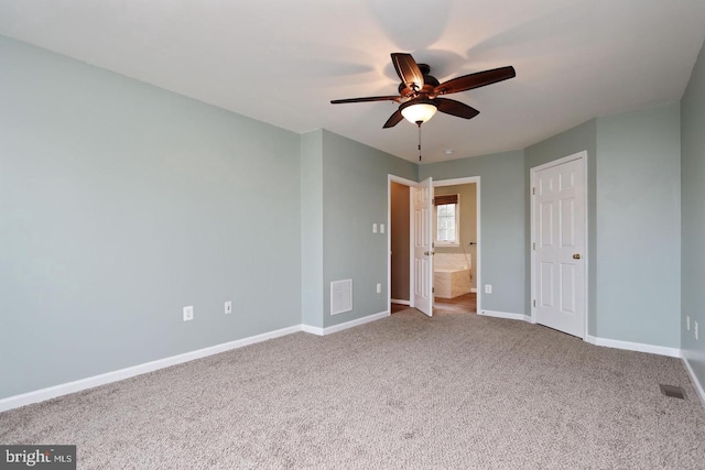 unfurnished bedroom with ceiling fan, connected bathroom, and carpet floors