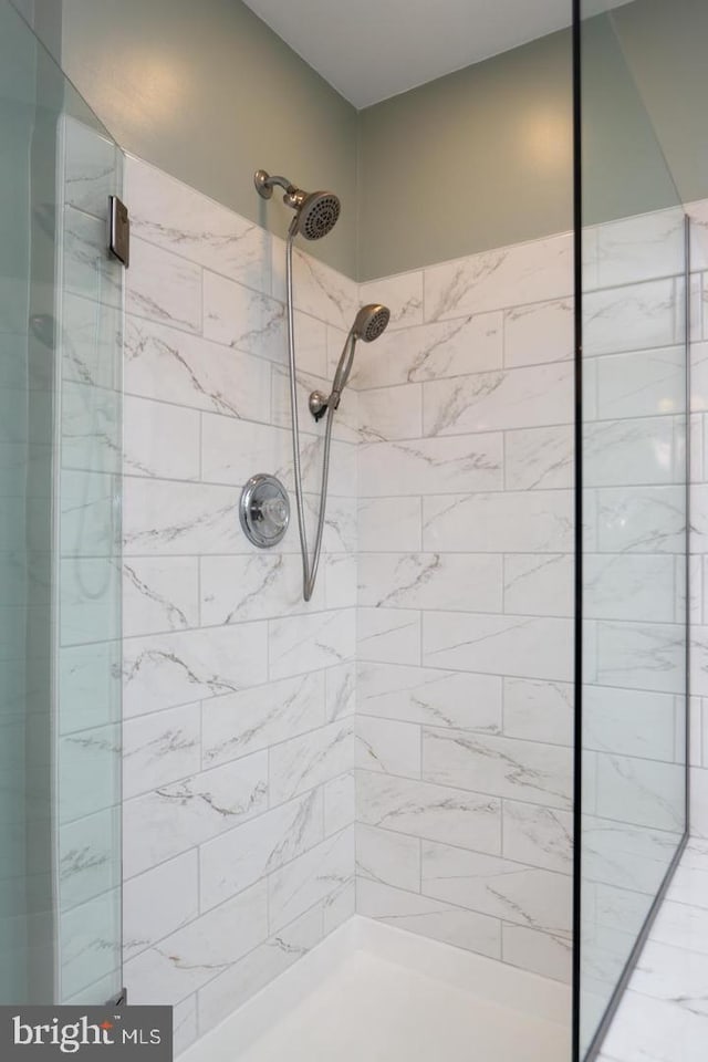 bathroom with a tile shower