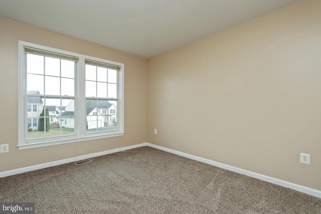 unfurnished room with carpet floors