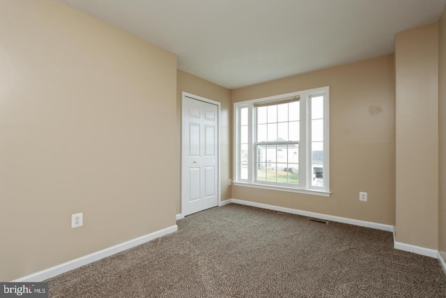 empty room featuring carpet