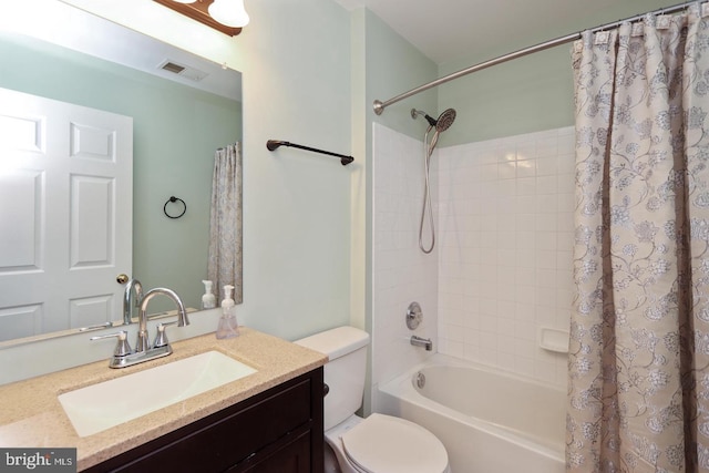 full bathroom featuring vanity, toilet, and shower / tub combo