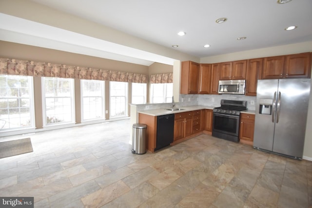 kitchen featuring sink, tasteful backsplash, and stainless steel appliances