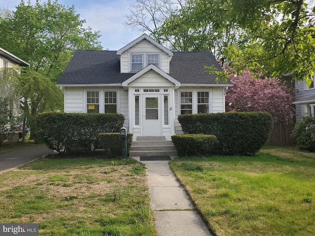 57 Elizabeth St, Pemberton, NJ 08068 - view of front of house featuring a shingled roof and a front lawn
