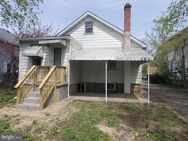 57 Elizabeth St, Pemberton, NJ 08068 - back of house with a patio and a chimney
