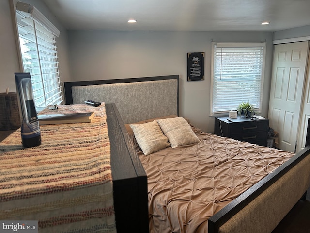 bedroom with multiple windows