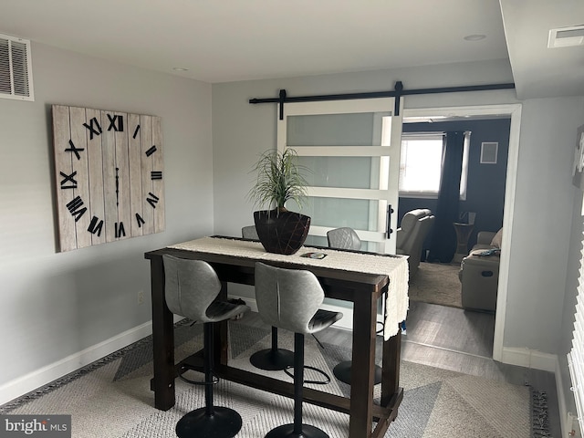 dining space with a barn door