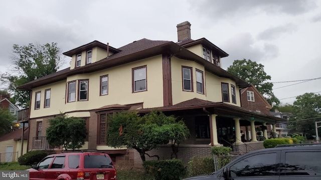 view of property exterior with covered porch