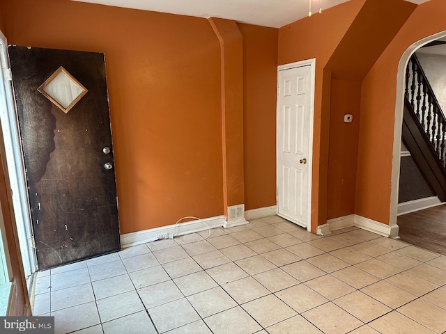 entryway featuring light tile patterned floors