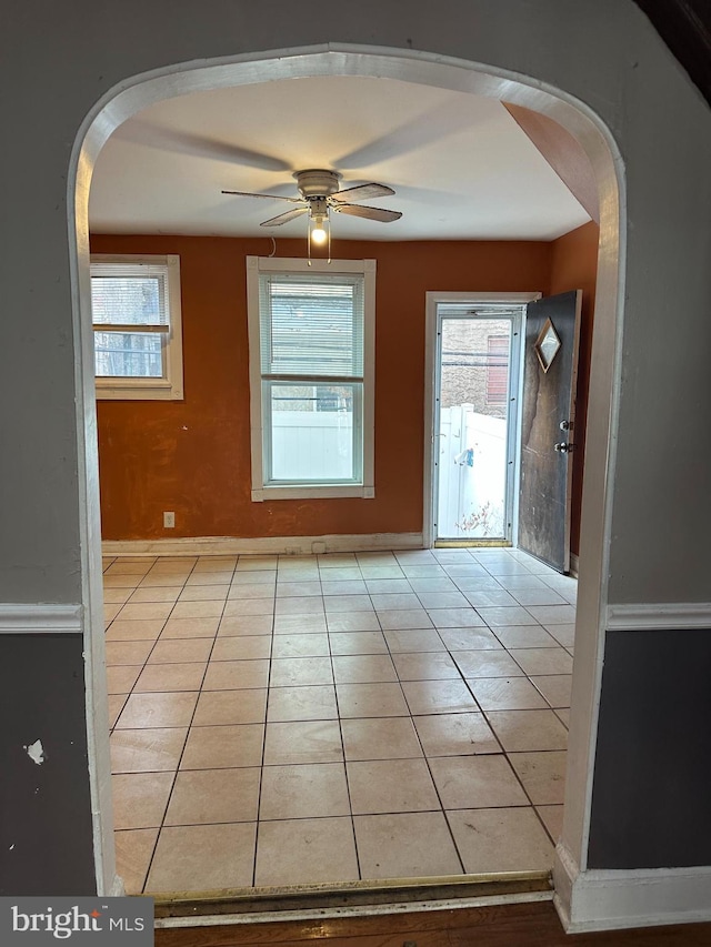 tiled entrance foyer featuring ceiling fan