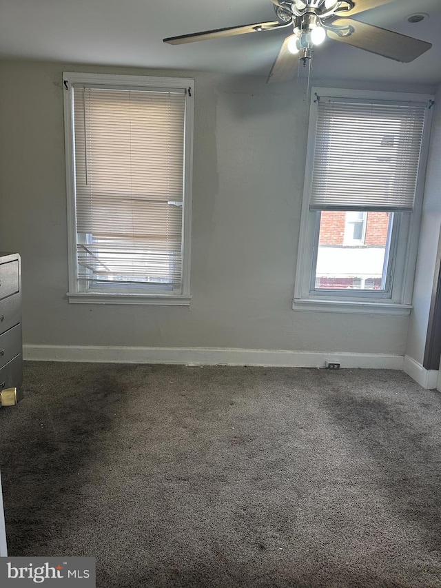 spare room with ceiling fan and carpet flooring