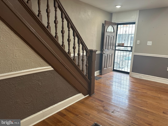 foyer entrance with hardwood / wood-style floors