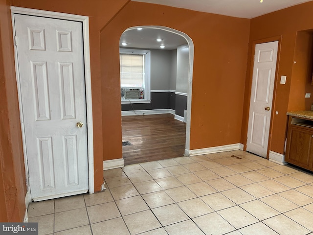 interior space with cooling unit and light tile patterned floors