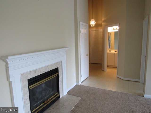 unfurnished living room featuring light colored carpet