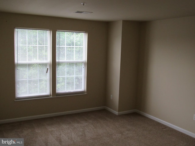 empty room with carpet flooring