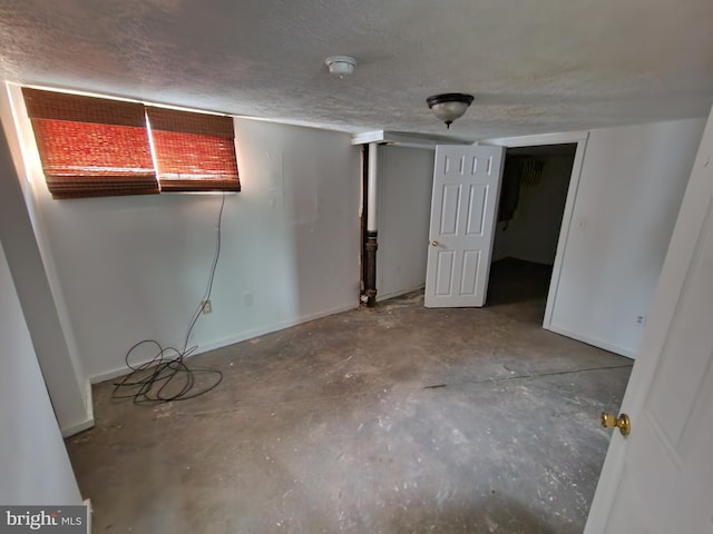 basement with a textured ceiling