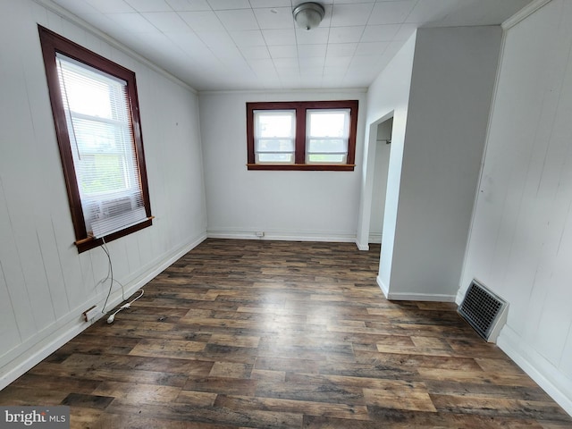 unfurnished room with dark hardwood / wood-style floors