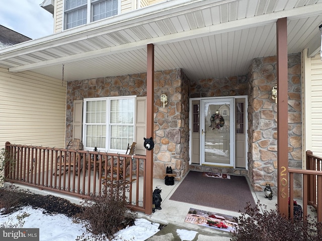 view of snow covered property entrance