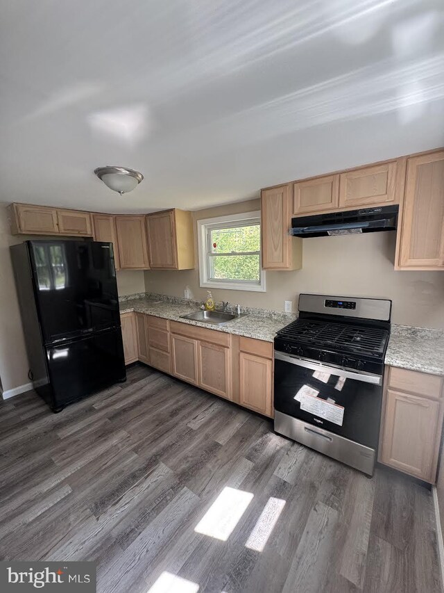 145 Press Ave, Browns Mills, NJ 08015 - kitchen with stainless steel gas range, freestanding refrigerator, under cabinet range hood, dark wood finished floors, and a sink