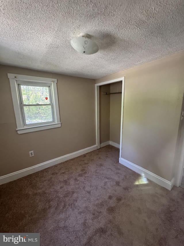 145 Press Ave, Browns Mills, NJ 08015 - unfurnished bedroom with carpet floors, a closet, baseboards, and a textured ceiling