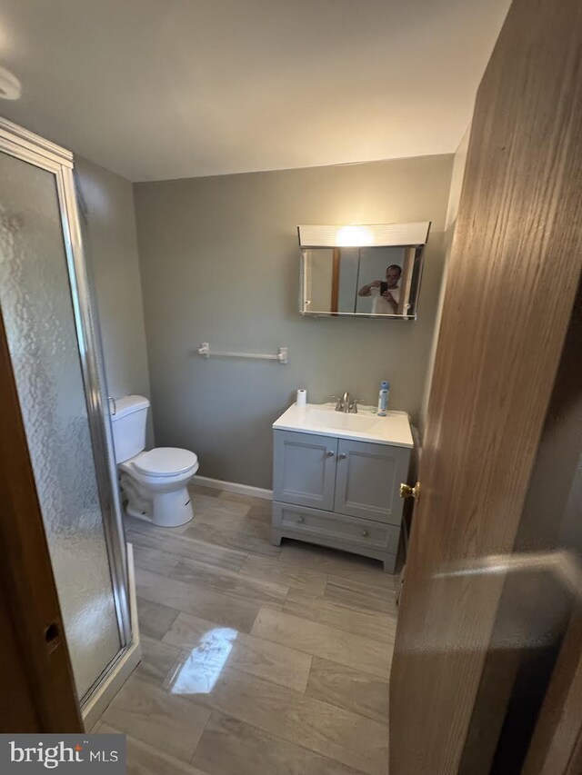 145 Press Ave, Browns Mills, NJ 08015 - full bath featuring toilet, vanity, a stall shower, and baseboards