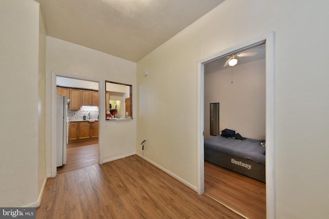 hall with light wood-type flooring