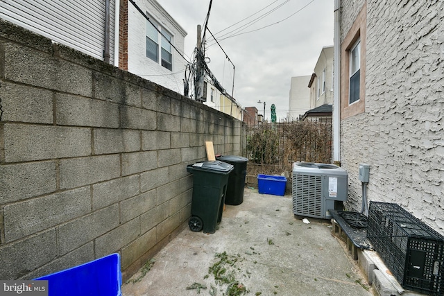 view of side of property with central AC unit