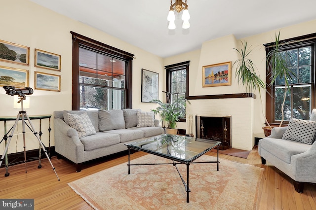 living area featuring a fireplace and wood finished floors