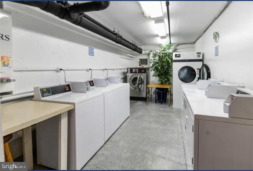 clothes washing area featuring washing machine and dryer