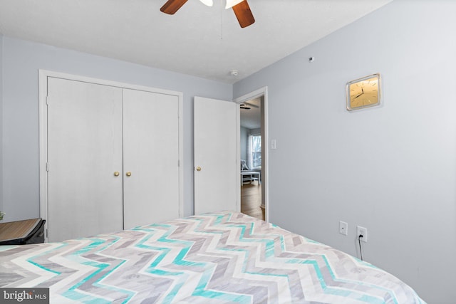 bedroom with ceiling fan and a closet