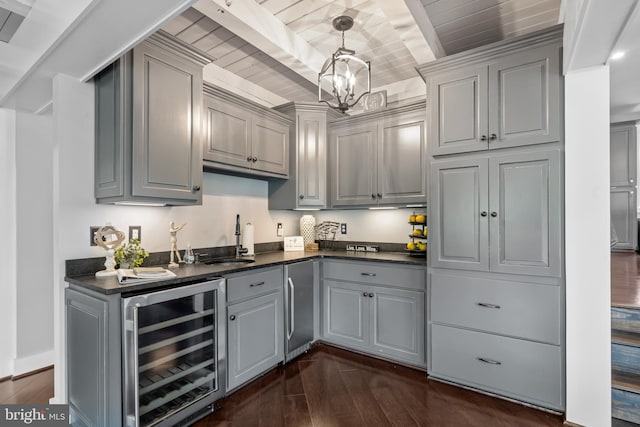 kitchen featuring dark wood-type flooring, gray cabinetry, wine cooler, and sink