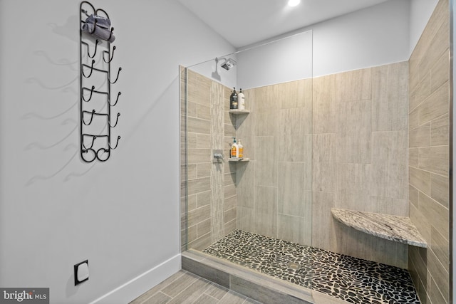 bathroom featuring a tile shower