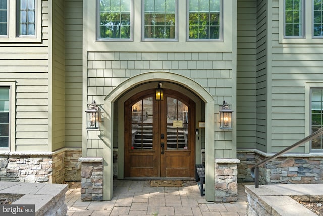 view of exterior entry featuring french doors