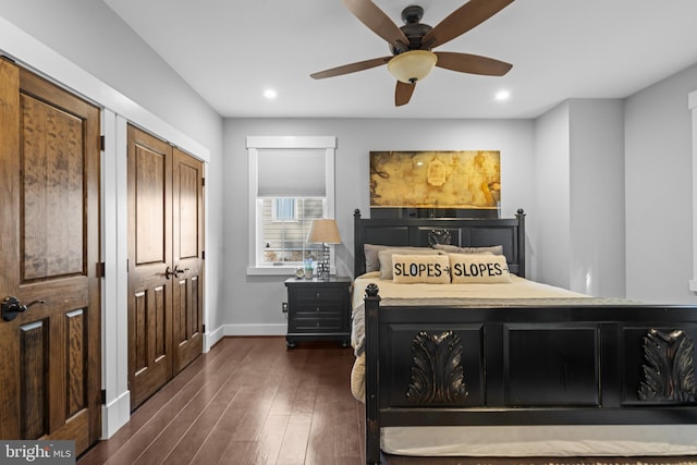 bedroom featuring ceiling fan and dark hardwood / wood-style floors