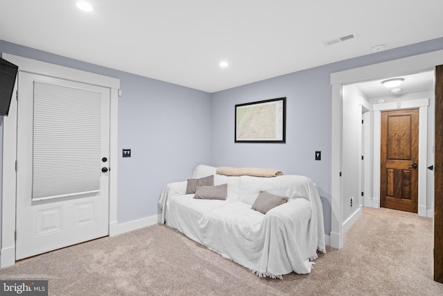 bedroom with light carpet