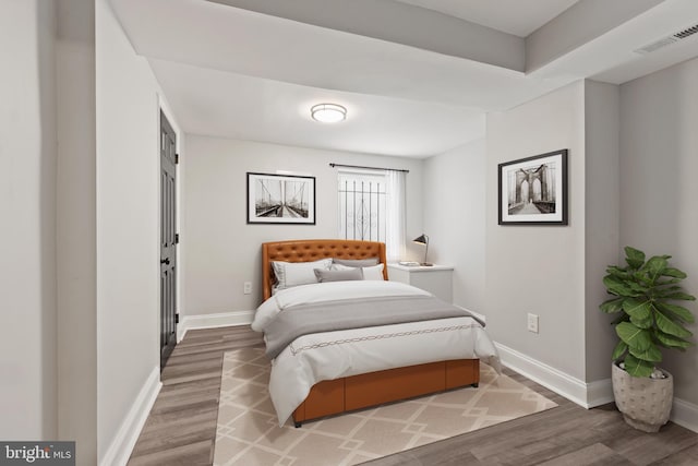 bedroom featuring hardwood / wood-style flooring