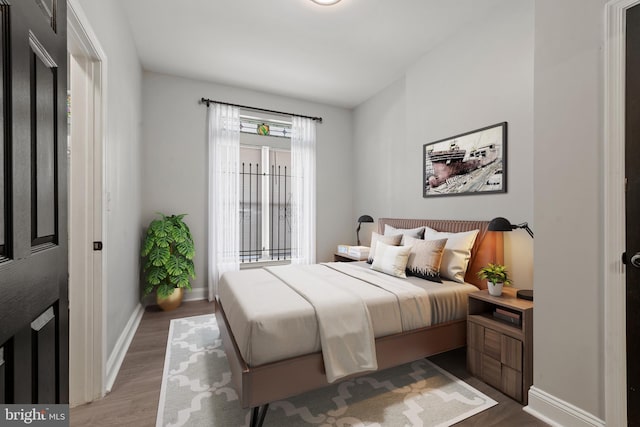 bedroom featuring dark wood-type flooring