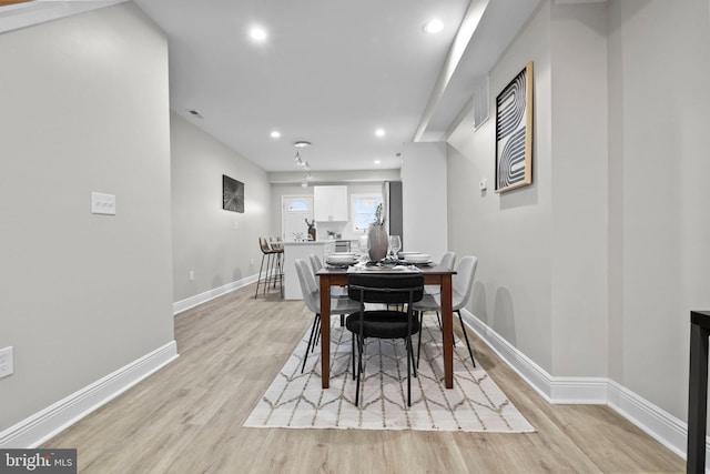 dining space featuring light hardwood / wood-style floors