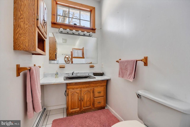 bathroom with vanity, toilet, tile patterned flooring, and a baseboard heating unit